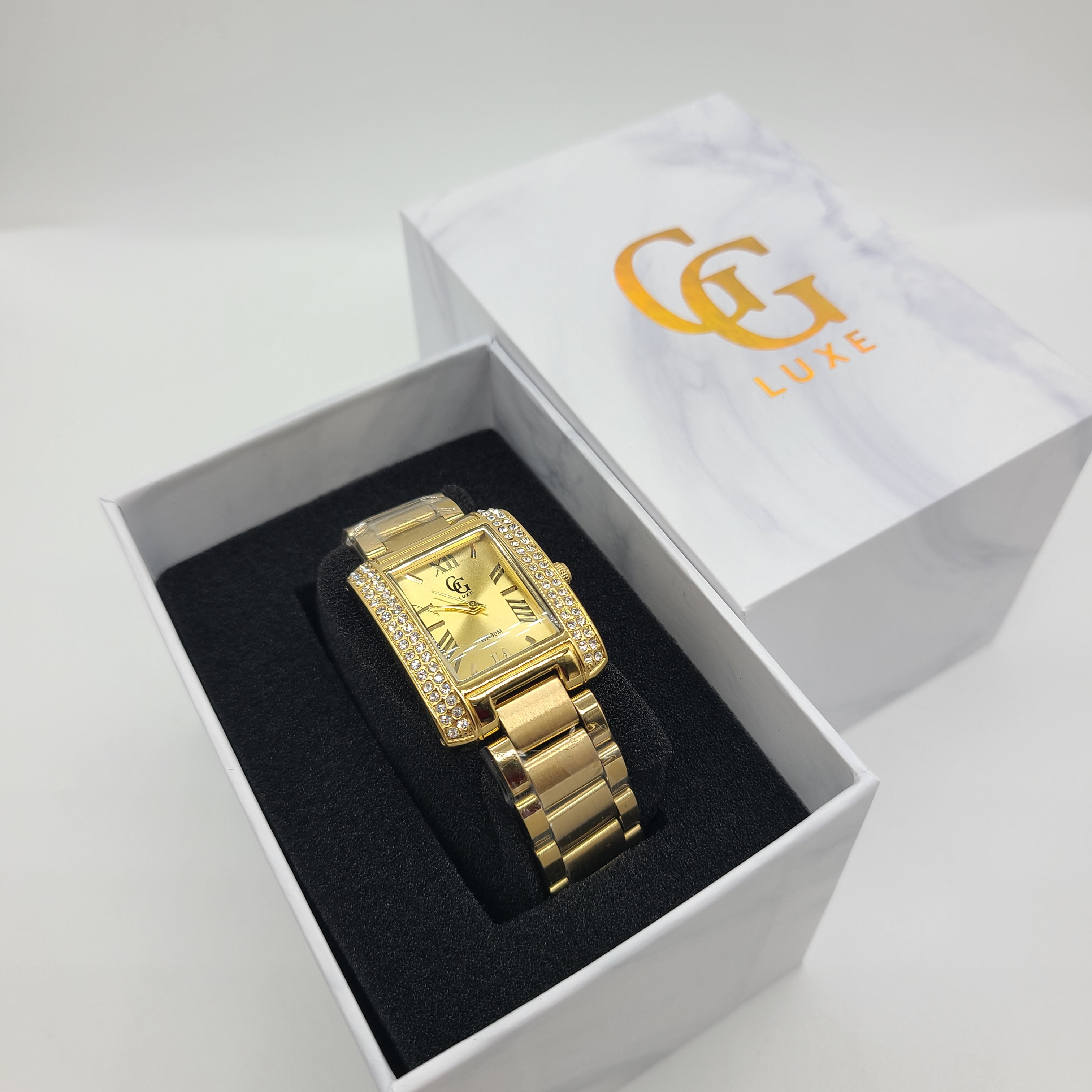 Montre doré cadran rectangulaire